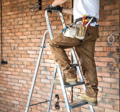 electrician-with-tools-working-construction-site-repair-handyman-concept