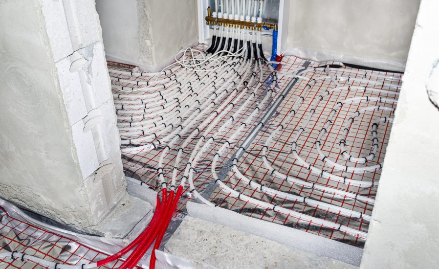 white-pipes-underfloor-heating-systems-arranged-foil-passing-through-foundation